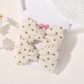 Set di 2 graziose mollette a fiocco in tessuto nido d'ape color crema con pois marroni - Waffle a Pois Beige