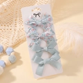 Floral and solid green fabric bow hair clip set of four on a white display card - Light Green Floral Fabric Style (4E)