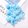Set of light blue elastic hair ties with soft faux fur pom poms on white marble surface - Light Blue Style (10A-17)