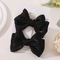 Set di due fermagli per capelli con fiocco in raso nero lucido per bambine su carta - Set Fermagli a Fiocco / Nero