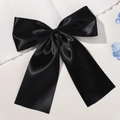 Elegant girls' black satin bow hair clip with streamers and a glossy finish - Black (5153-4)