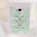 Set di due fermagli per capelli a farfalla glitter verde menta con lustrini colorati - 2a-51 (2 Buste Opp Con Una Carta)
