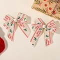 Set of two Merry Christmas ribbon hair clips with reindeer print and red borders - Off-White Grosgrain (2A-7)