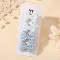 Set of four light blue bow hair clips with embroidery and checkered patterns on card - Light Blue Bow Print And Blue White Grid Combo (5217-4D)