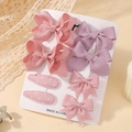 Vue détaillée du lot de 8 barrettes nœuds rose et violet sur carte de présentation - Ensemble de 8 pièces / Série Rose