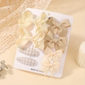 Lot de 8 barrettes à cheveux à nœuds crème et beige présentées sur une carte - Ensemble de 8 pièces / Série Beige