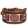 Vintage brown wide leather bracelet featuring a Kolovrat sun wheel symbol and metal buckle - Brown Leather + Antique Copper