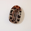 Detail view of leopard print hair clip with stylish parallel hollow cut-out design - Oval Clip (Bulk) / Glossy Light Tortoise