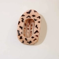 Close-up of leopard print hair clip with hollow oval design and smooth resin finish - Oval Clip (Bulk) / Glossy Pink Tortoiseshell
