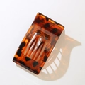 Macro shot of large rectangular leopard print hair clip with tortoiseshell resin texture - Bulk/Loose Packaging / Glossy Red Leopard
