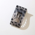 Detailed macro view of the sleek rectangular grey leopard print hair clip with hollow slot - Bulk/Loose Packaging / Matte White Leopard