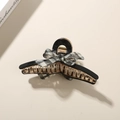 Elegante pinza per capelli in acetato nero con bordo dorato e fiocco in tessuto a quadri - Nero - Fiocco Plaid