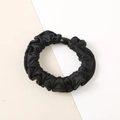Elegant black faux silk scrunchie with pleated texture and oval decorative buckle - Black - Satin Medium
