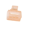 Detail view of pink translucent acrylic hair claw clip with golden metal spring and engraving - Peach
