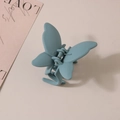 Detailed side view of a minimalist butterfly hair claw clip in matte Morandi blue finish - Bulk Packaging / Slate Gray