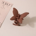 Detail of a matte brown butterfly hair claw clip featuring a premium frosted finish texture - Bulk Packaging / Chocolate