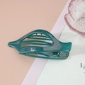 Macro detail of dark green glossy hair clip with streamlined curved teeth design - Single OPP Bag (Individual) / Malachite green