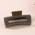 Detail view of large olive green rectangular hair claw clip with cutout design - Bulk Packaging / Dark Gray