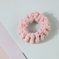 Detail of pink plush spiral hair tie with soft chenille texture and sparkling metallic fibers - Korean Pink