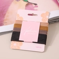 Detalle del set de 16 gomas de pelo de alta elasticidad en colores de tierra - Serie Café Juego