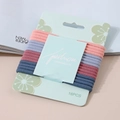 Detalle de 16 cintas elásticas para el pelo en colores Morandi con tarjeta - Serie Morandi Juego