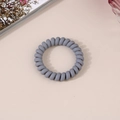 Close-up of matte grey spiral phone cord hair tie on a soft minimalist background - Matte Dark Gray