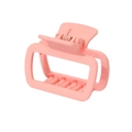 Detail view of pink matte square hair claw clip with non-slip teeth and metal spring - Pink