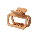Detailed macro view of large peach rectangle hair claw clip with matte finish and metal spring - Khaki