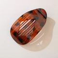 Flat oval tortoiseshell claw clip with diamond cutout and sturdy grip design - Transparent Red Leopard