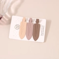 Detailed close-up of matte duckbill hair clips in coffee tones on a white display card - Coffee No-Trace Clip Set