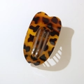Flat oval tortoise shell hair clip with deep brown amber texture and hollow design - Glossy Yellow Leopard