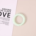 Elastic mint green spiral phone cord hair tie with a smooth minimalist resin finish - Glossy Green