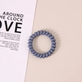Elastic blue spiral hair tie in matte blue finish for creaseless ponytail styling - Glossy Purple Blue