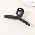 Matte black 13cm hair claw clip with cross twist design on a minimal cream background - Matte Black