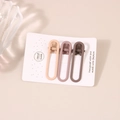 Three-piece set of matte oval hair clips in beige, pink, and brown on a gift card - Coffee Series Oval Clip (A4181)