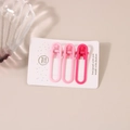 Three-piece pink gradient matte hollow hair clips on a white handmade display card - Pink Series Oval Clip (A4181)