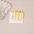Detailed macro view of three matte yellow rectangular hair clips on a white display card - Yellow Series Rectangular Clip (C4183)