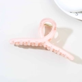 Pink translucent 13cm hair claw clip with twisted design and artistic text on white background - Glossy Light Orange