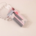 Close-up of pink and black Korean style hair rollers with long clips in clear packaging - #5 Pink & Black (boxed/pair)