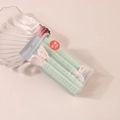 Close-up of hair roller set in mint green with clips in a clear retail display box - #1 Light Green (boxed/pair)