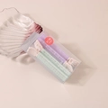 Detail view of purple and mint green hair root clips for volume in transparent box - #7 Green & Purple (boxed/pair)