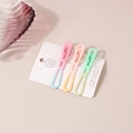 Close-up of three gradient macaron color metal hair clips on a white display card - Bowknot Style Set