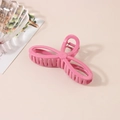 Polished bright pink resin hair claw clip in a cute bow shape for women hairstyling - Peach