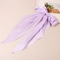 Elegant lavender satin bow hair clip with long streamers on a white decorative plate - Light Purple