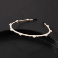 Elegant thin gold metal headband with various sizes of white pearls on dark background - Gold Edge Spaced Pearl Style (#1)