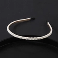 Elegant double-row pearl headband with a gold metal frame and black fabric ear guards - Double Row Fine Pearl Style