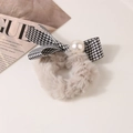 Close-up of plush camel hair scrunchie with houndstooth bow and pearl detail - Houndstooth-Milk Coffee