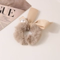 Detail of plush faux fur scrunchie with satin ribbon and large pearl accent - Solid-Grey Brown