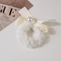 Detail of white plush faux fur scrunchie with cream ribbon bow and pearl accent - Solid-White