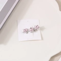 Barrette à cheveux Y2K avec trois cristaux d'étoiles roses sur base en métal argenté - Trois Étoiles Roses